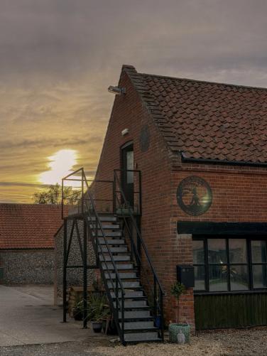 The Bayfield Brecks barn glowing at golden hour