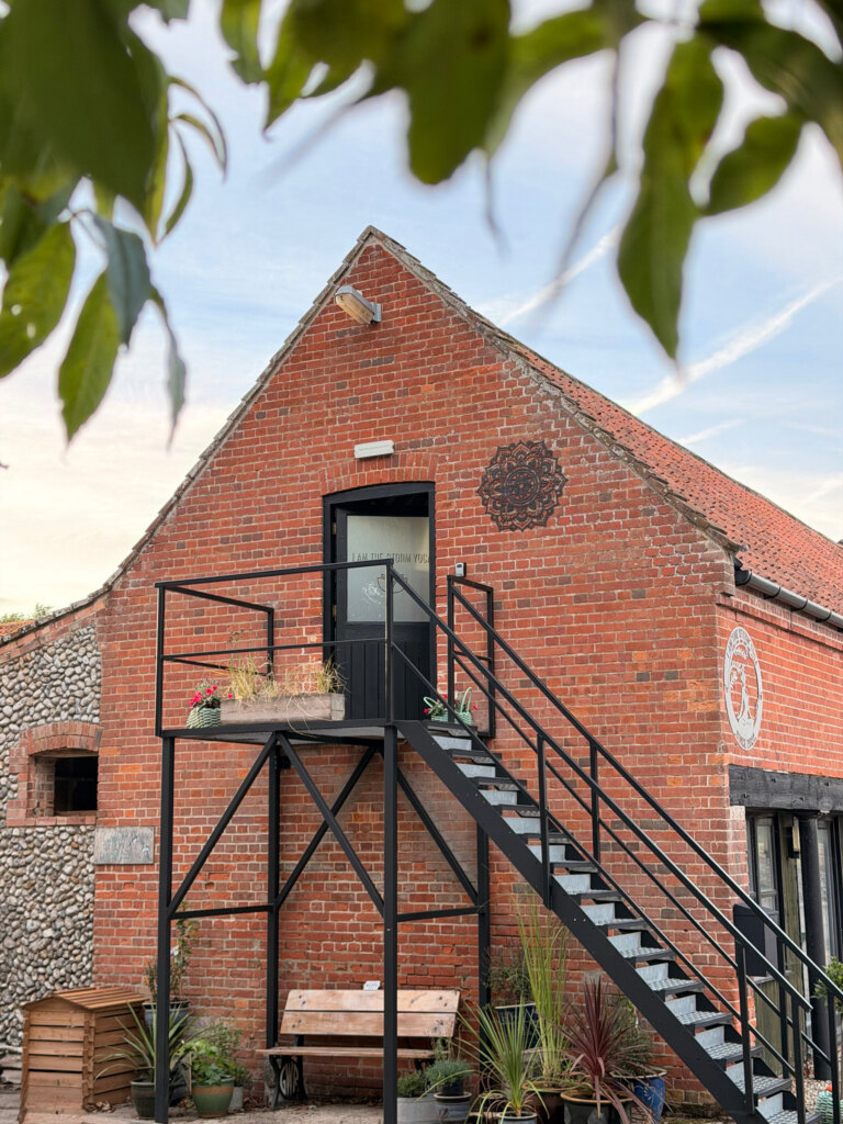 Summer sky above the brick barn at Bayfield Brecks